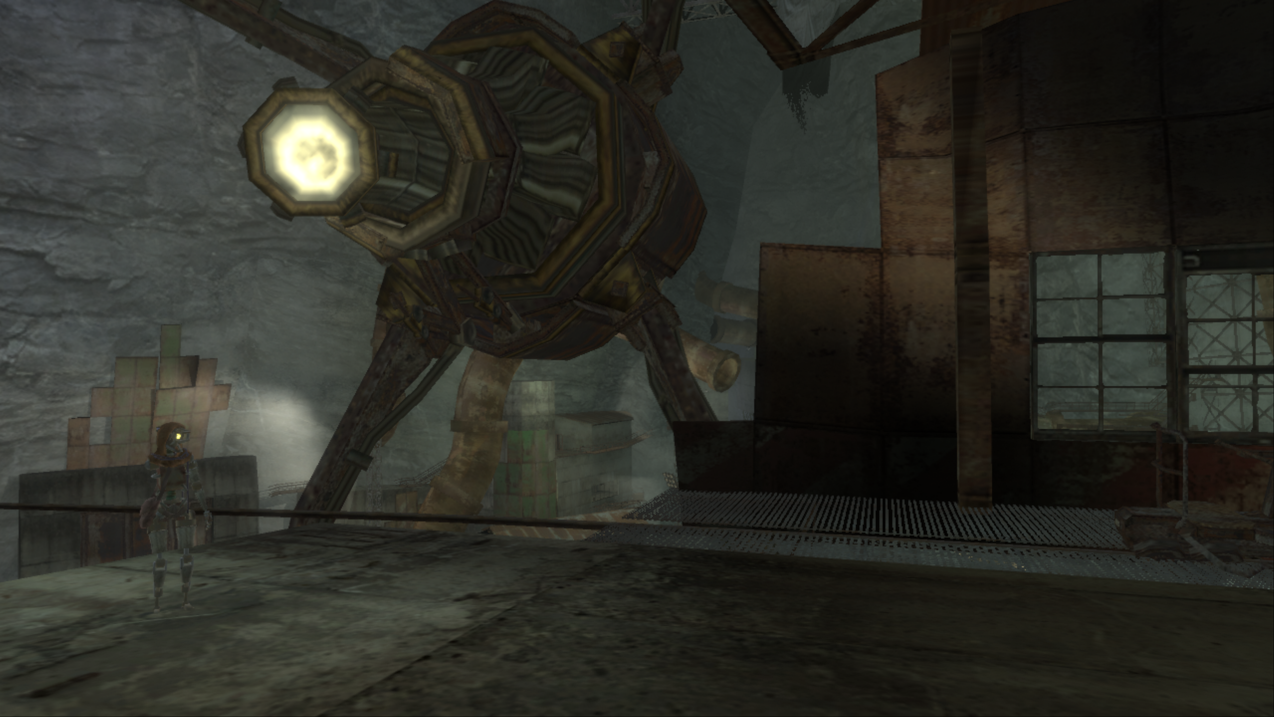 A view of the underground area. A rusty robotic like character is standing on metalic ground. In the backround is a huge machine consisting of metal, wires and a bright tube-like eye