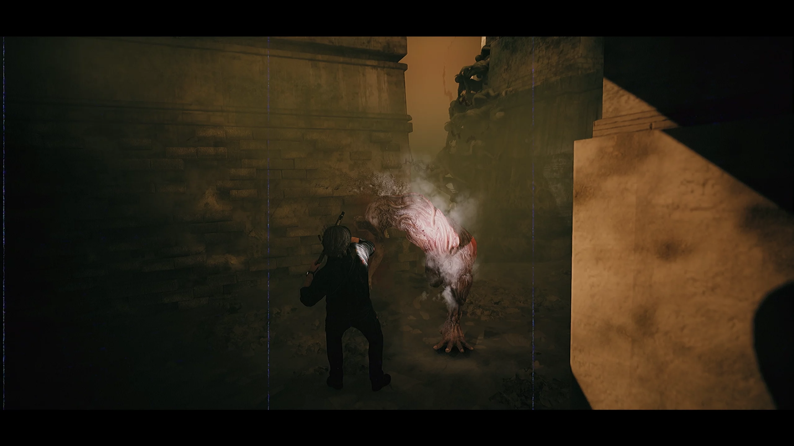 A man shooting at a flesh like monster.