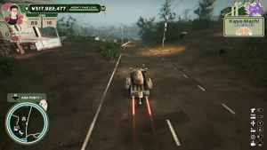 A car with a mascot is driving through the streets of a village.