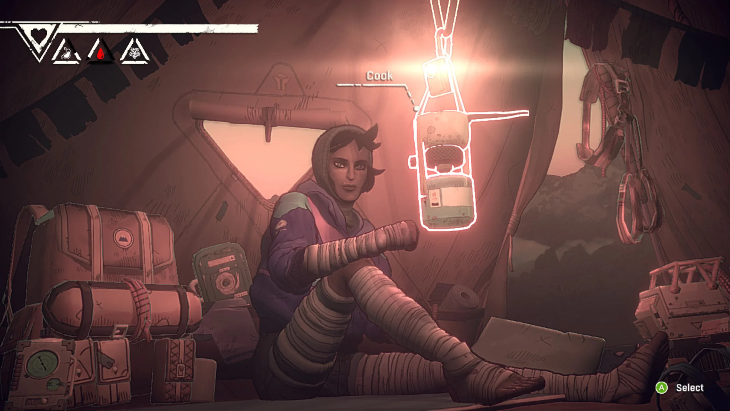 A woman sitting in a tend full of gear. She is looking ath ecooking pot.