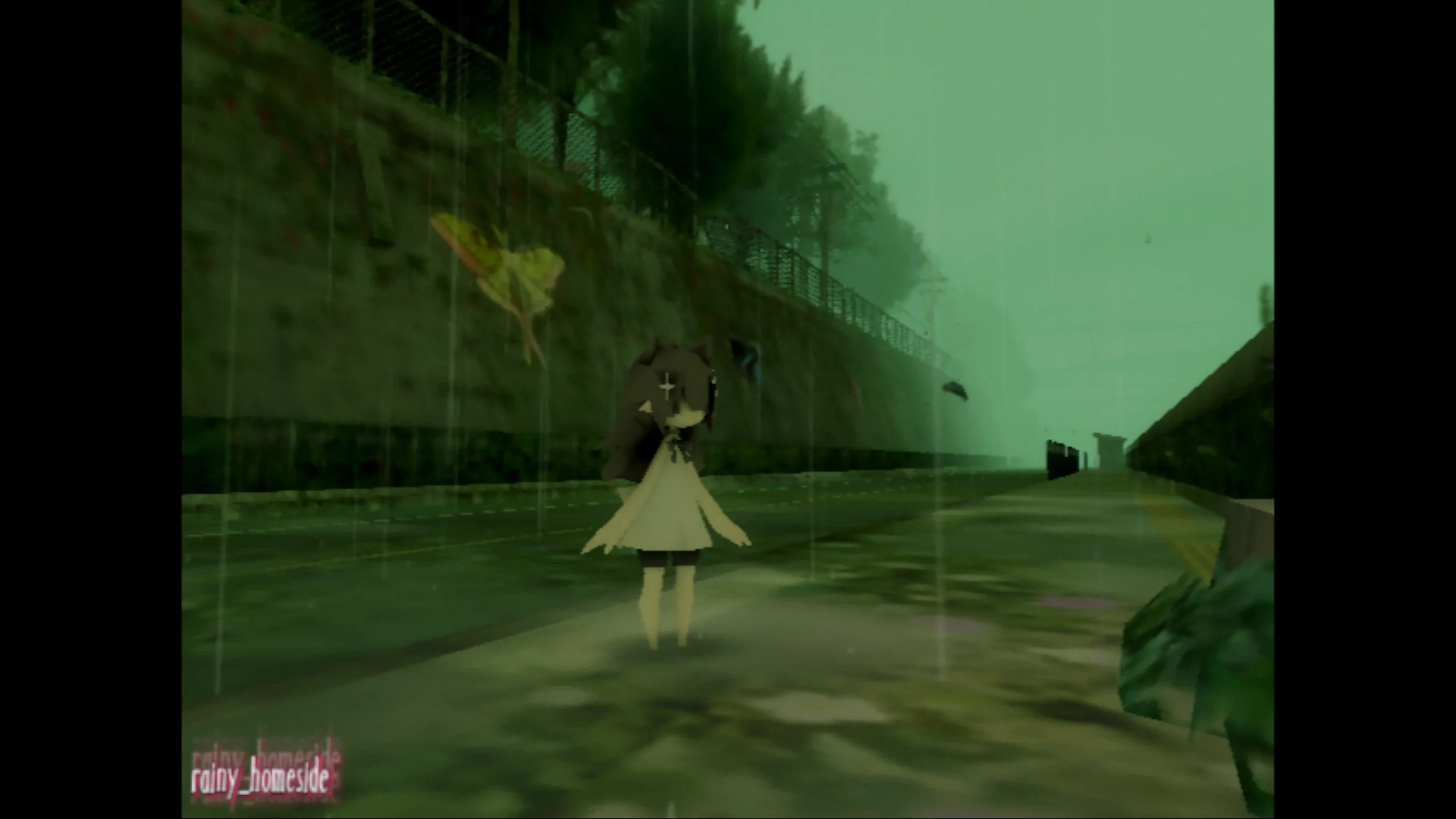 A girl standing on a pathway. It's raining.