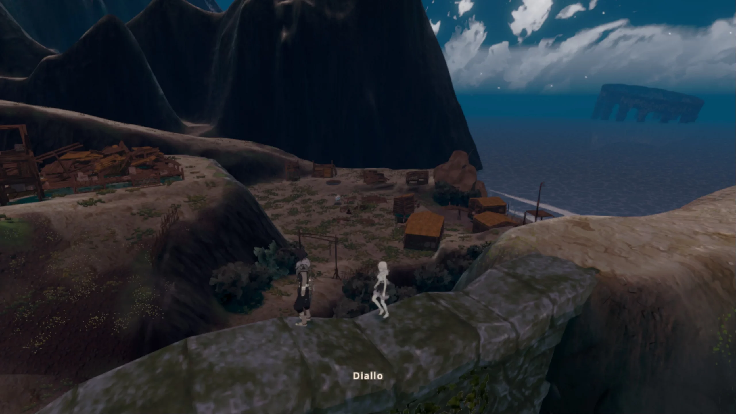 Two people walking across a stone wall, looking down at the area.